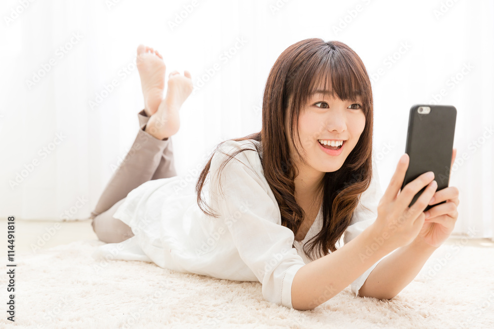 attractive asian woman using smart phone