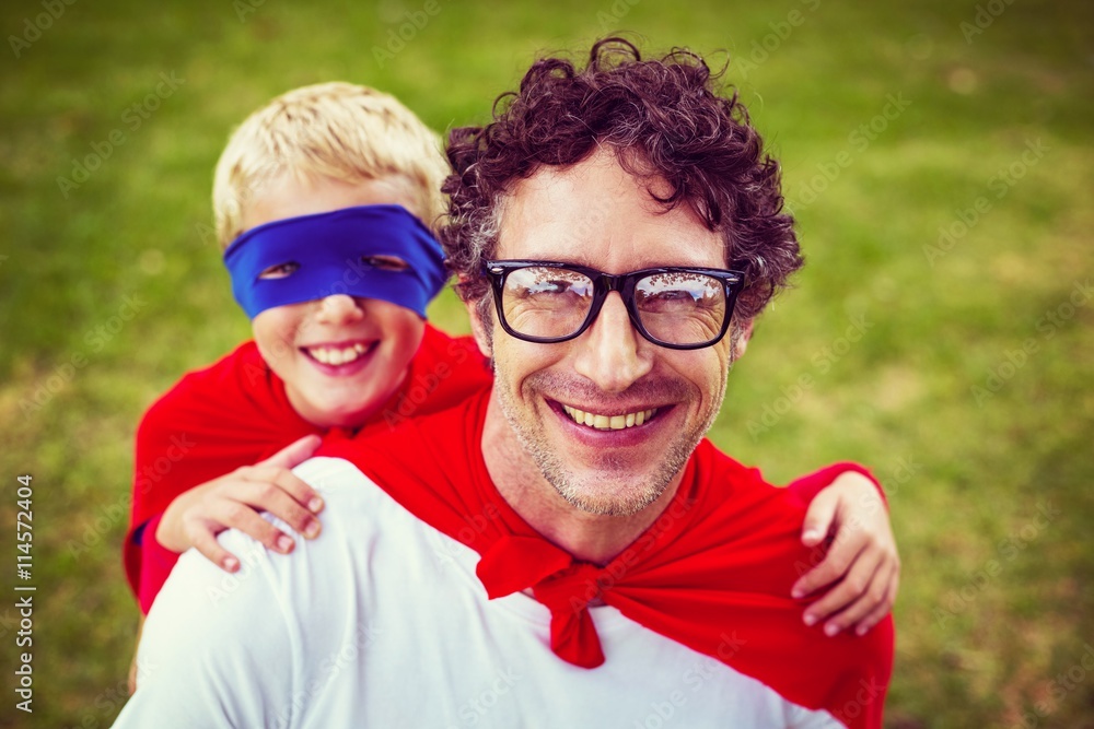 Father and son dressed as superman