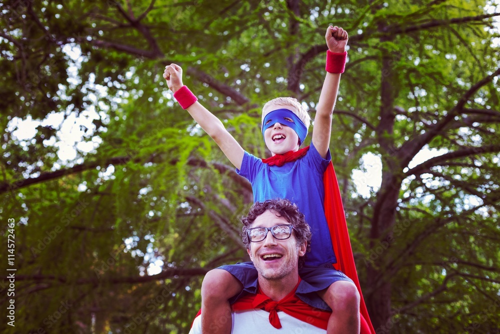 Father and son dressed as superman