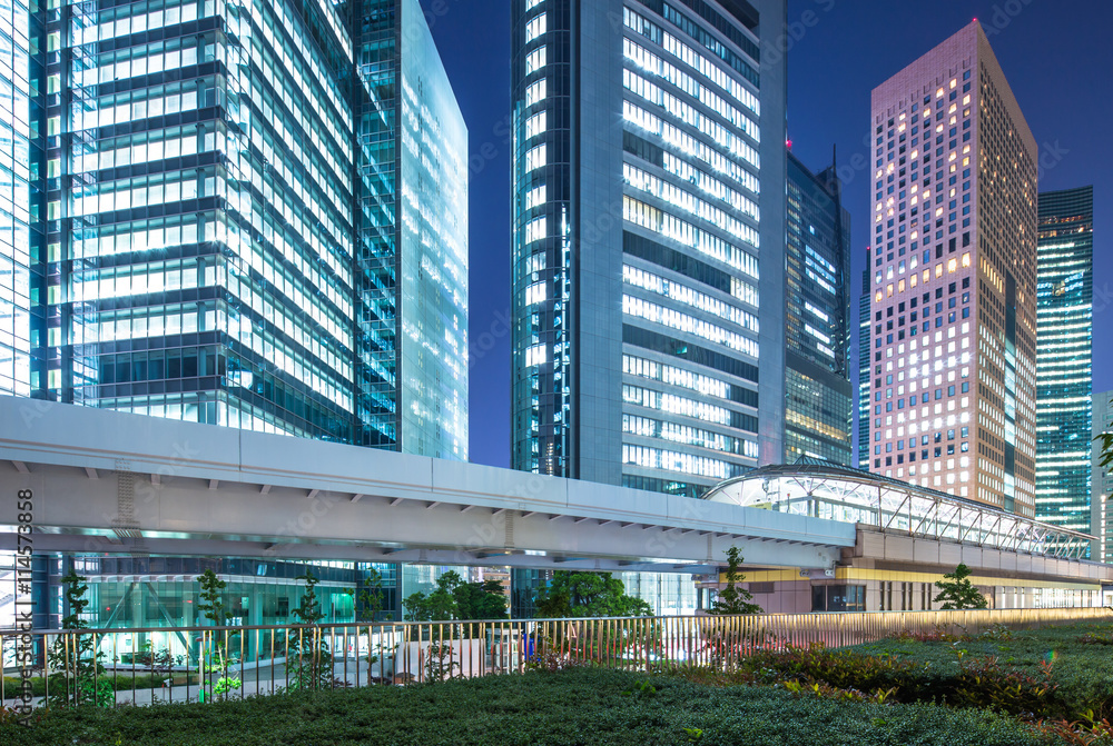 modern office buildings in downtown of tokyo at night