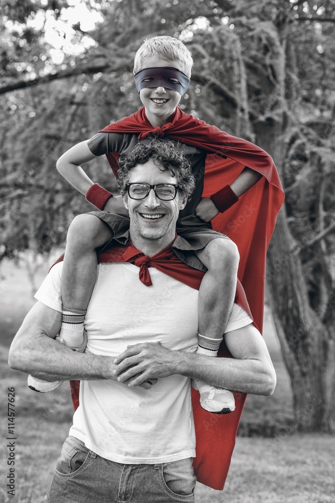 Father and son dressed as superman