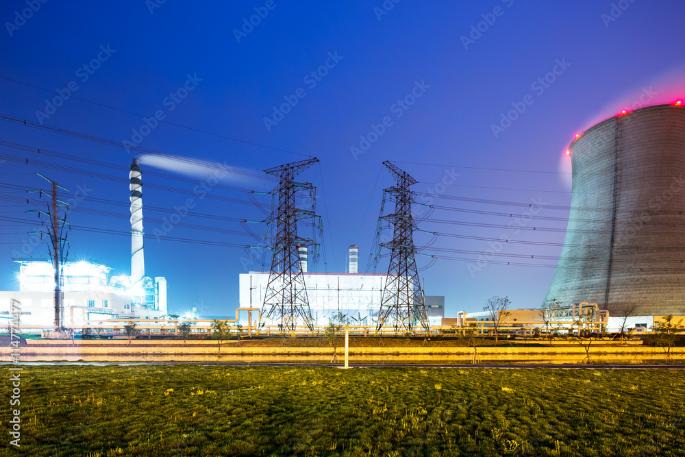 cool tower and high chimney in modern power station at twilight