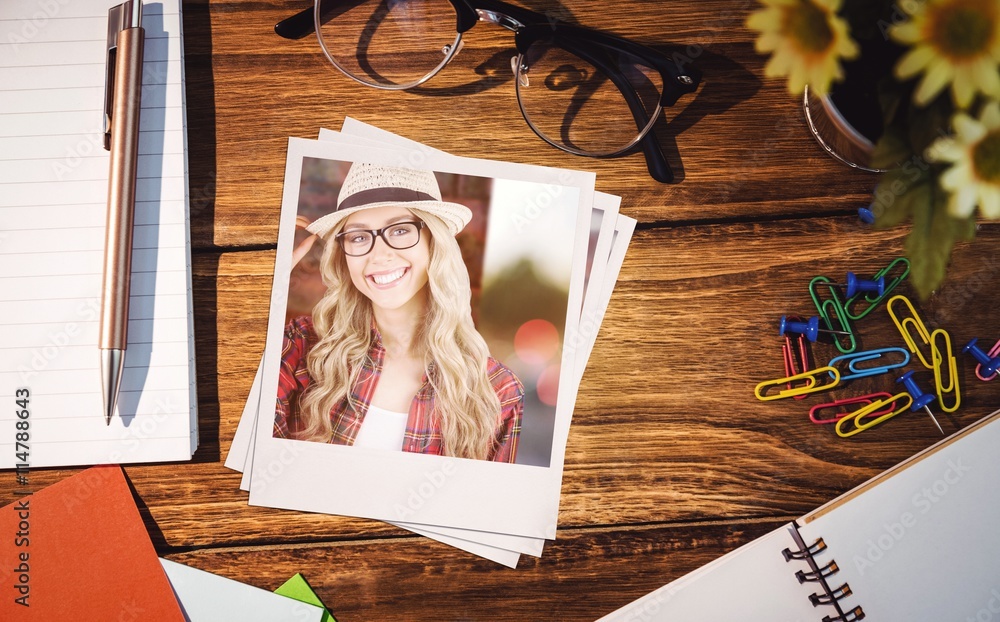 Composite image of gorgeous smiling blonde hipster posing