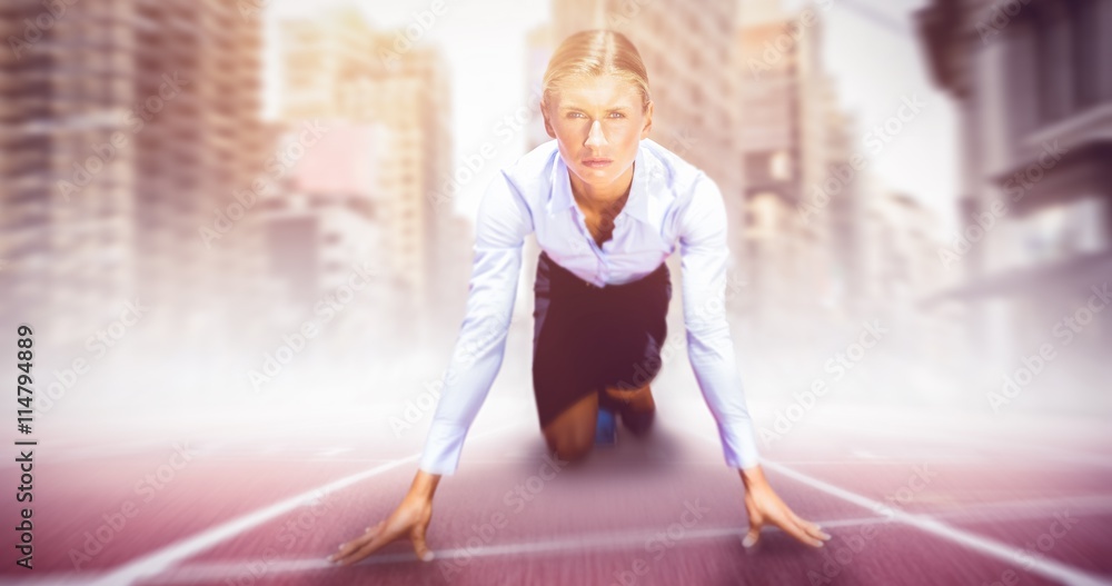 Composite image of businesswoman in the starting blocks