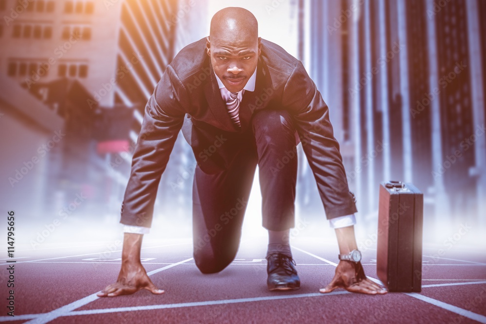 Composite image of businessman in the starting blocks