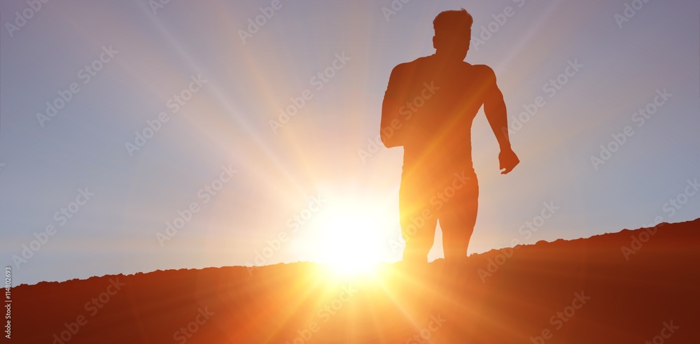 Composite image of athletic man jogging against white background