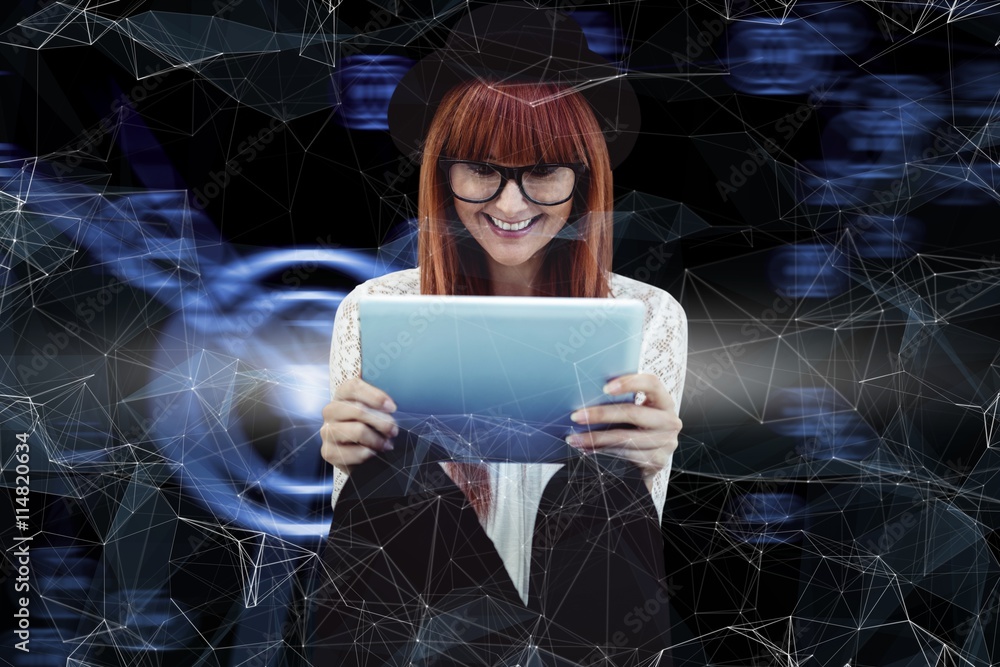 Composite image of smiling hipster woman using her tablet