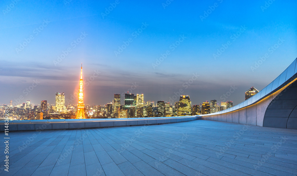 empty street with cityscape and skyline of tokyo at twilight