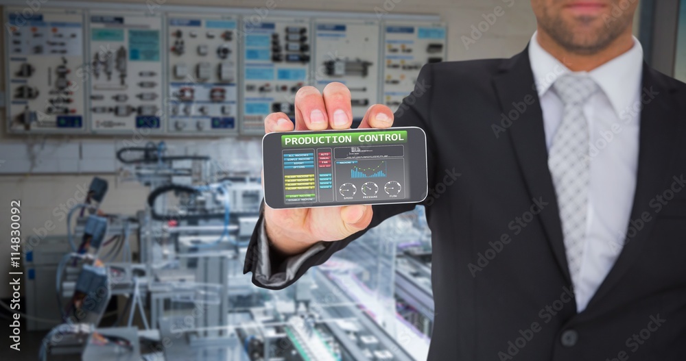 Composite image of businessman showing his smartphone screen