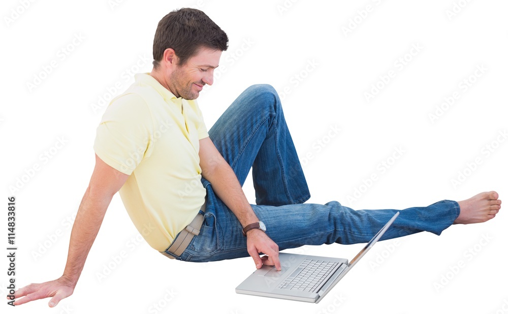 Smiling man using a laptop