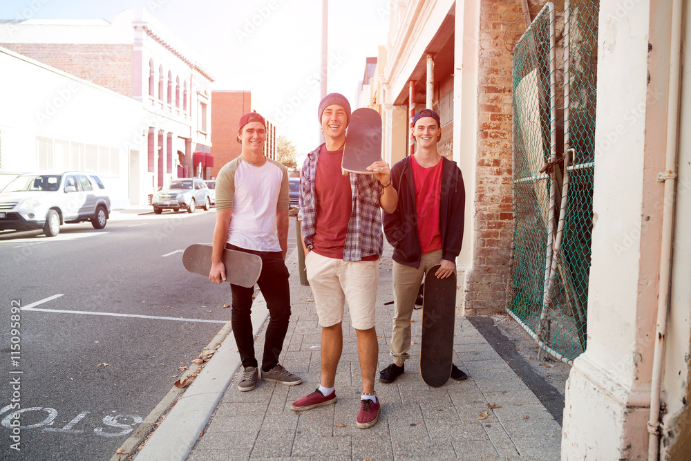 Guys skateboarders in street