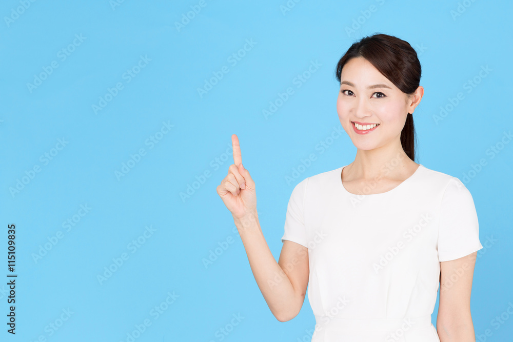 portrait of asian nurse isolated on blue background