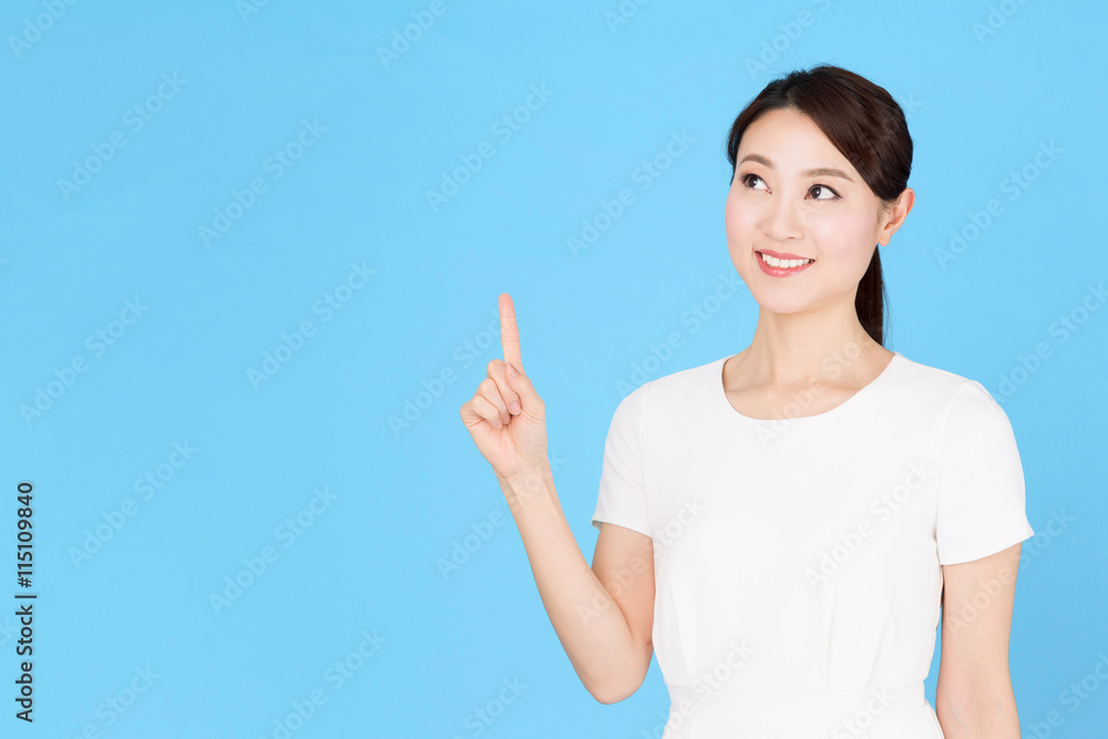 portrait of asian nurse isolated on blue background