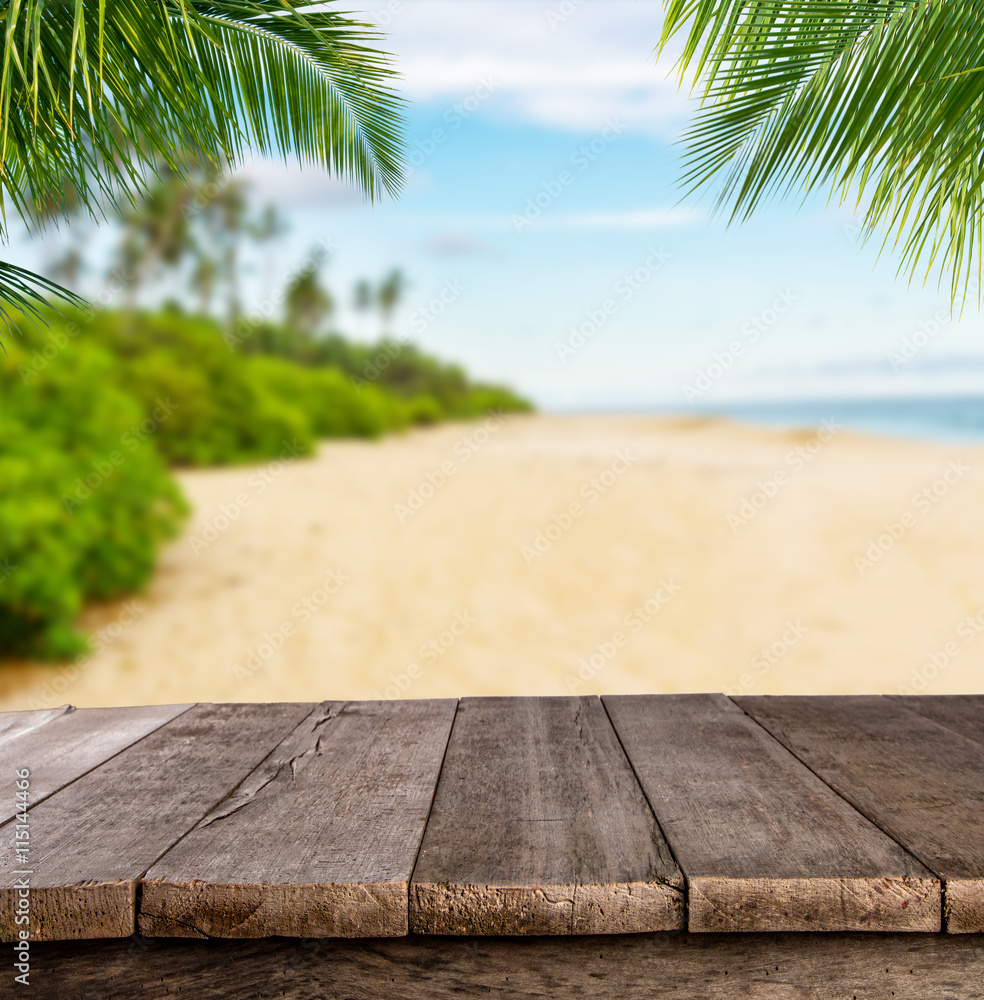 Empty wooden planks with blur beach on background