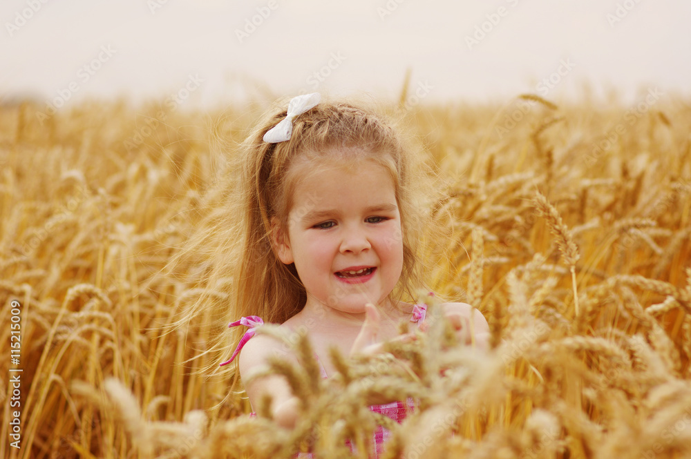 Girl on a wheat field