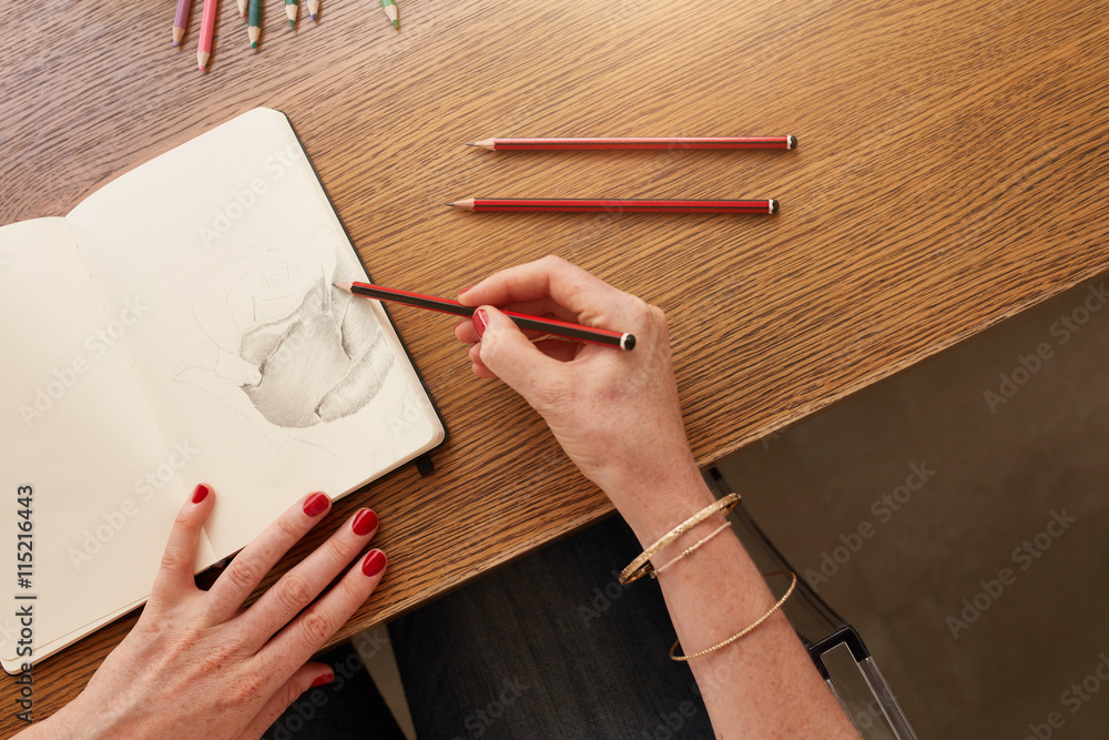 Female artist working with pencil sketch