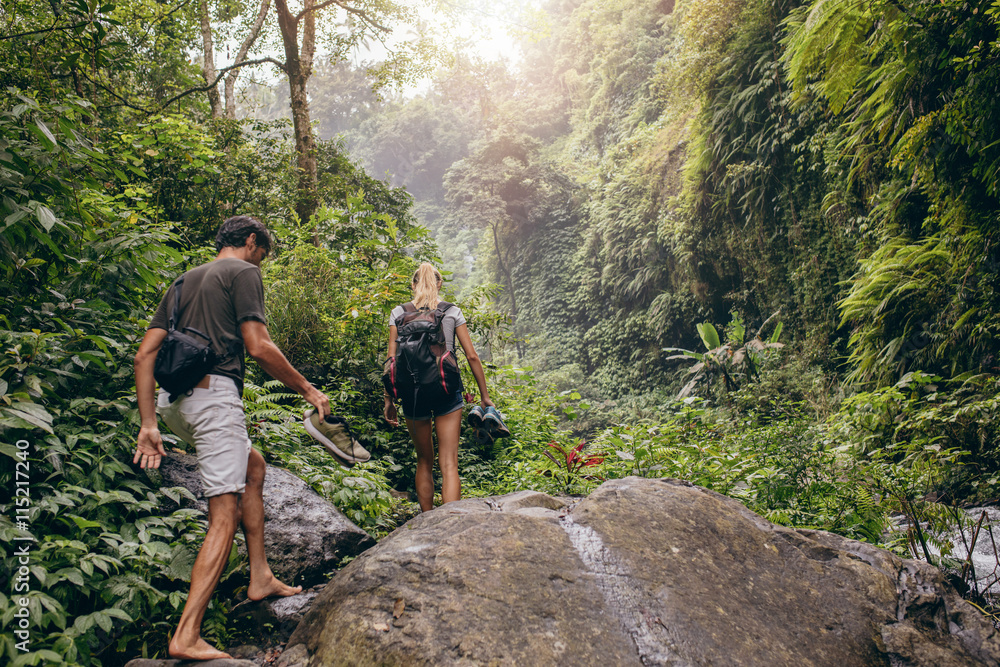 Couple hiking on mountain trail