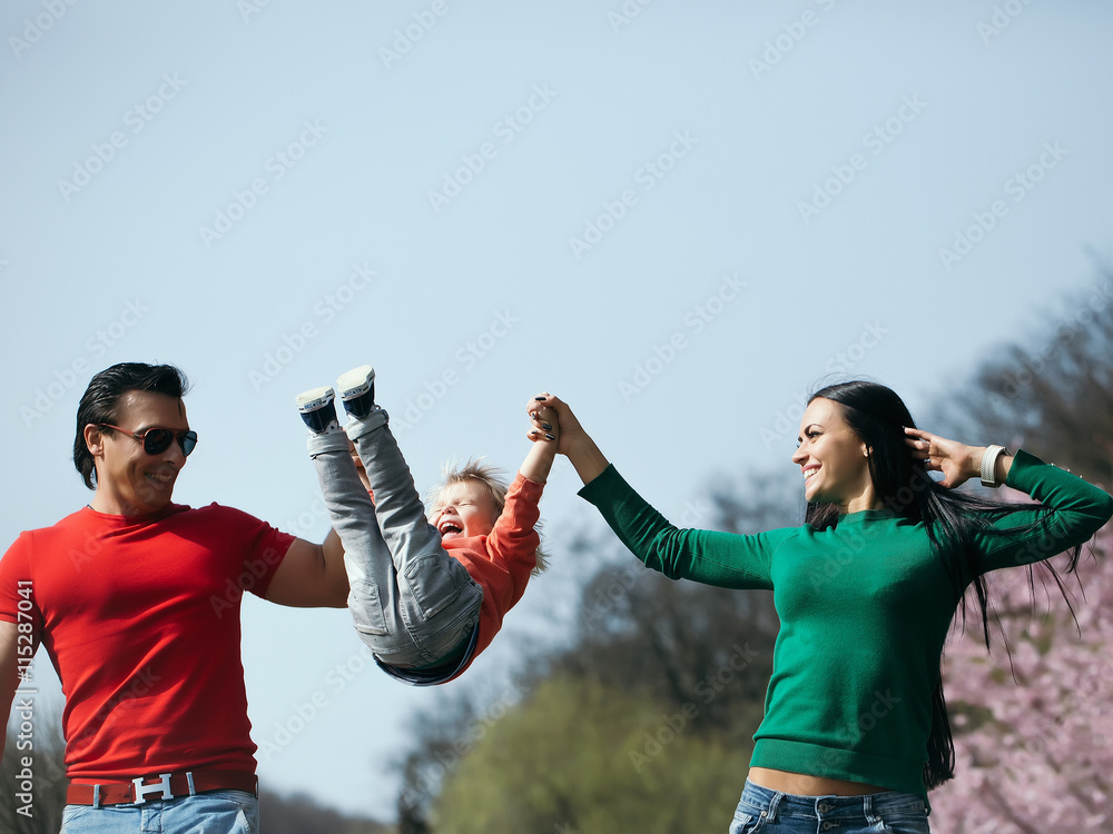 Happy family in blooming park