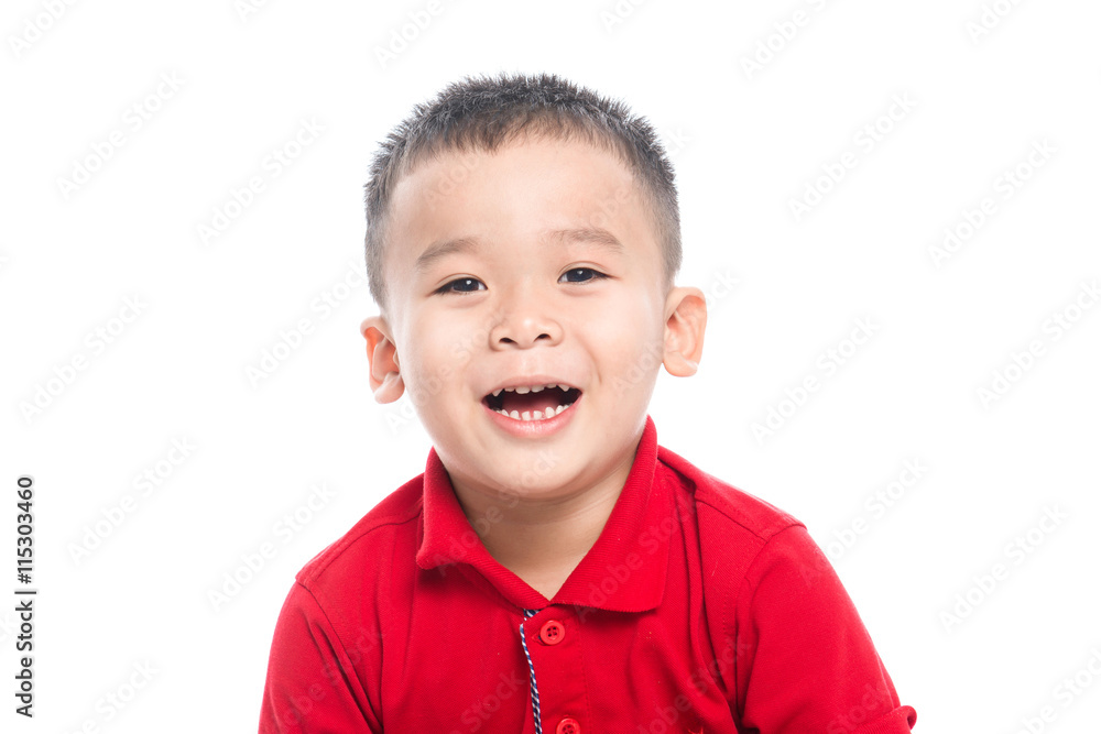 Photo of adorable young happy asian boy looking at camera.