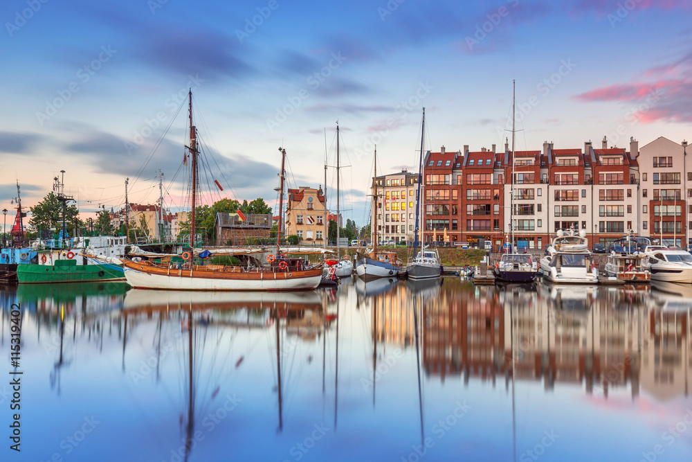 Marina of Gdank with reflection in Motlawa river at sunset, Poland