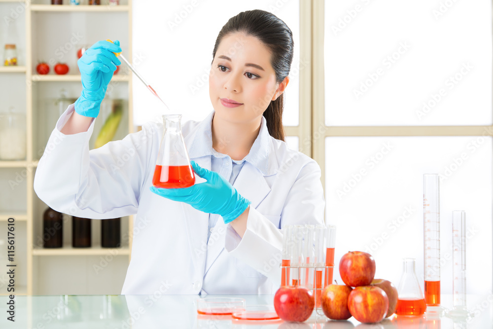 Asian female scientist drop the cure for genetic modification