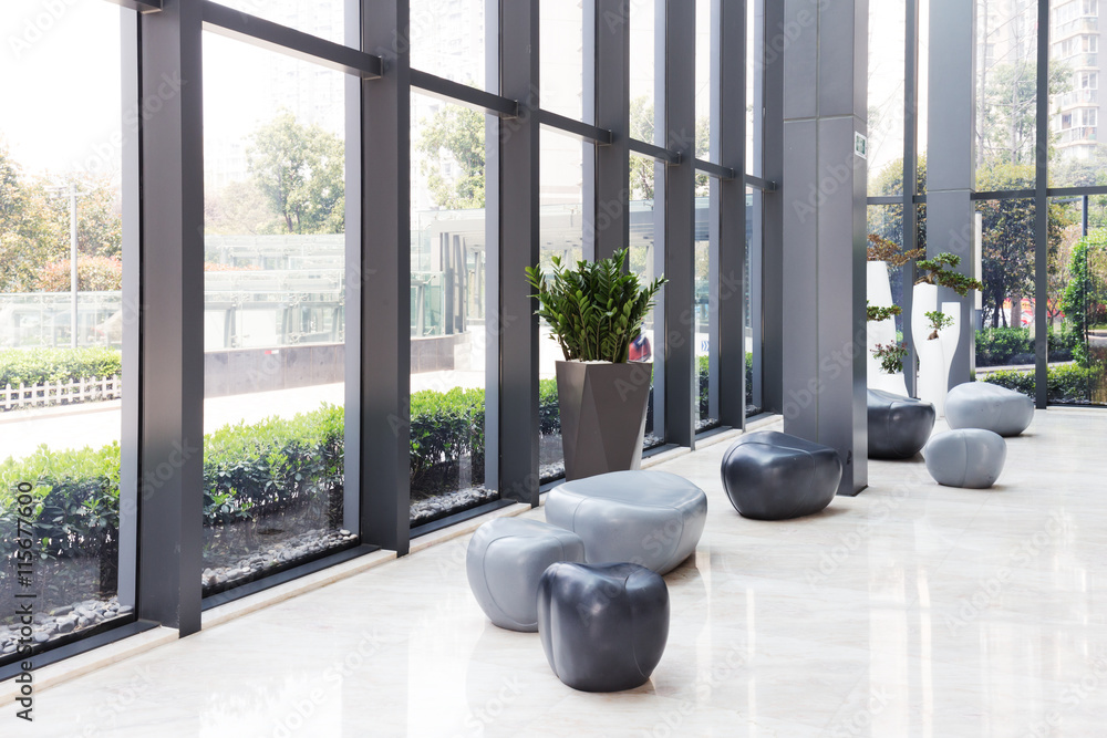 elegant stools and talbe in huge and bright hall