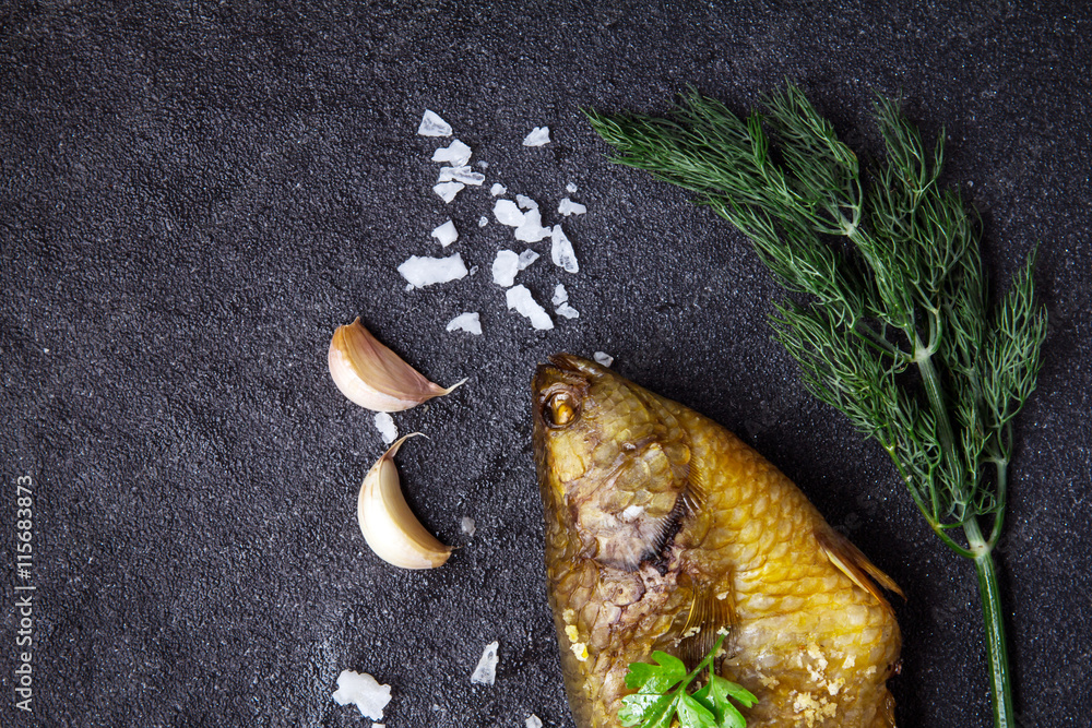 Delicious grilled fresh fish on dark stone background , healthy