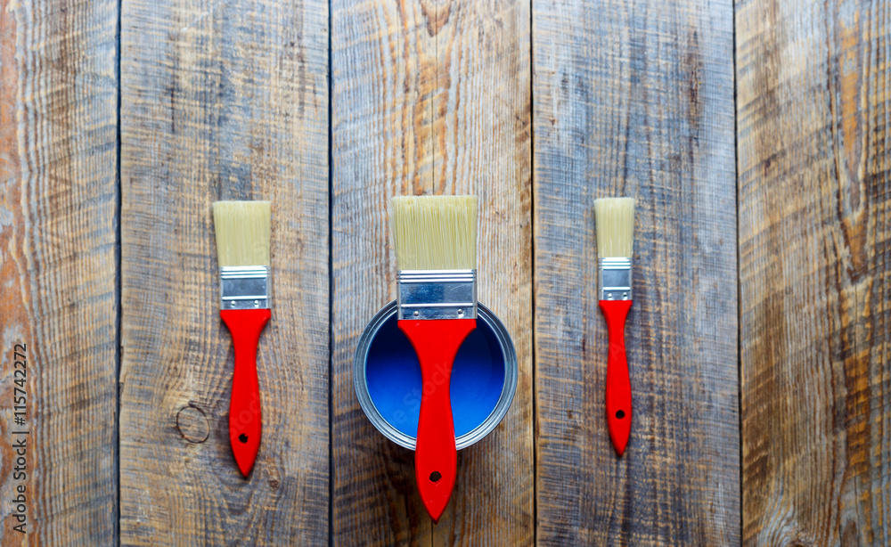 concept preparation for painting with can of blue paint