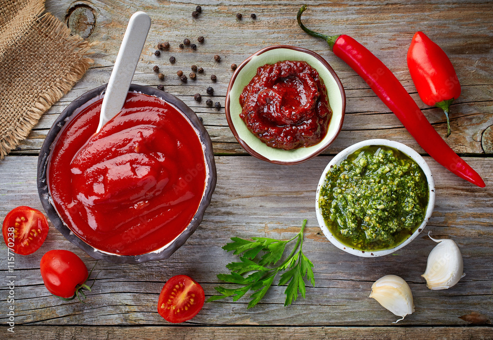 various sauces on wooden table