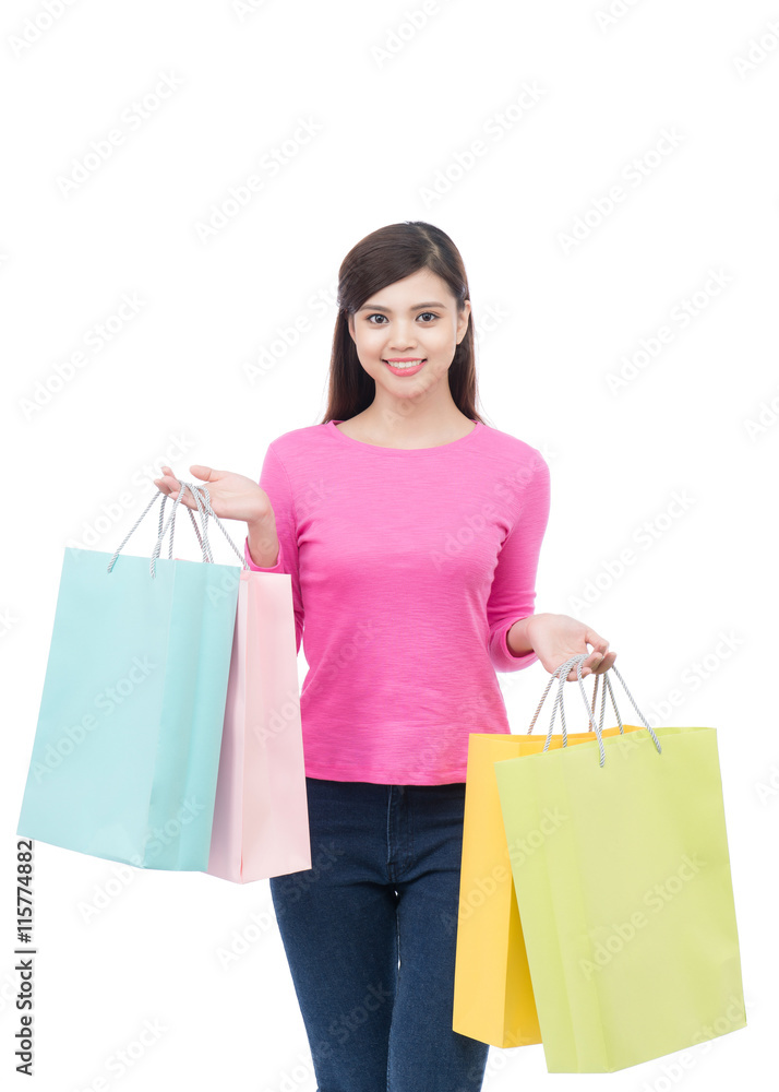 Beautiful young asian woman holding colored shopping bags