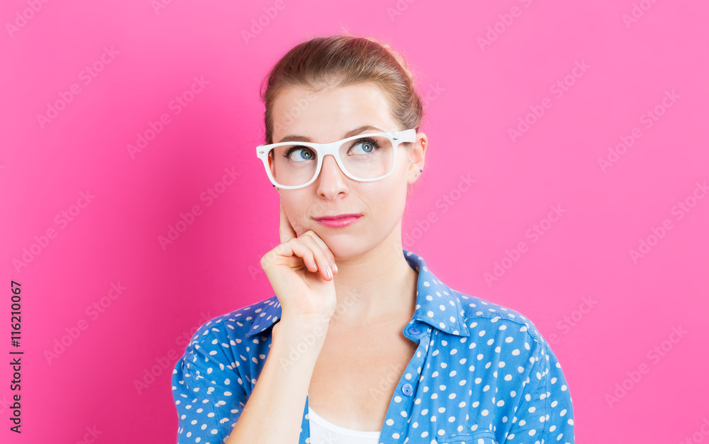 Young woman in a thoughtful pose