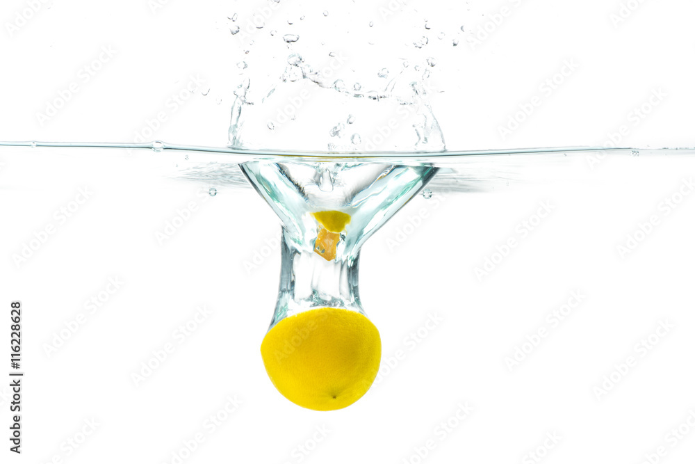 Fresh lemon dropped into water with splash isolated on white