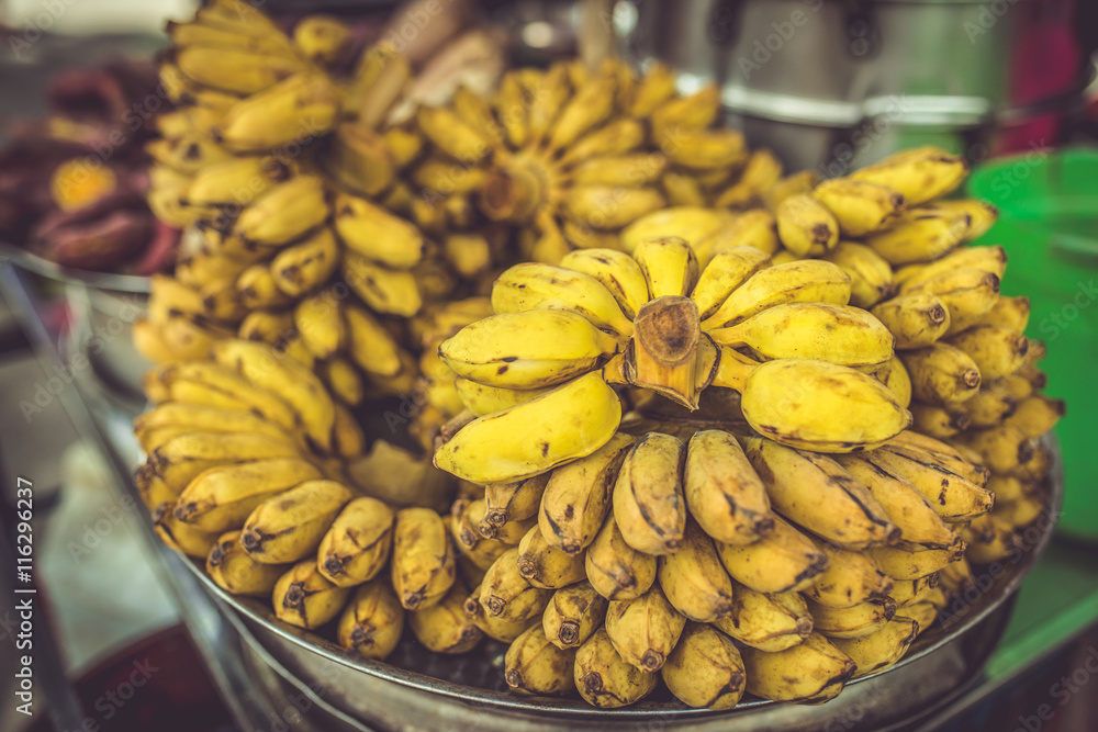 Street Food in Saigon, Vietnam. Banana sale in cart.