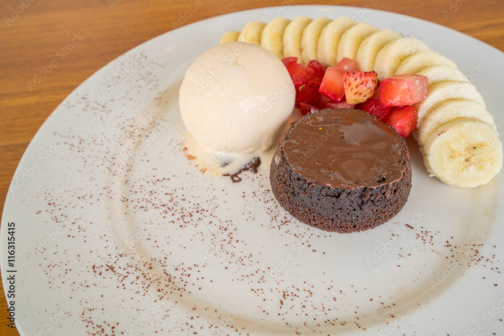 Chocolate lava cake with vanilla ice cream, strawberry and banana