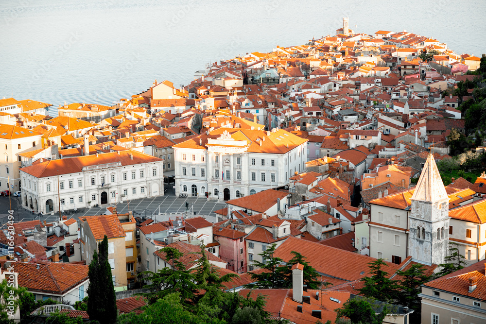 Aerial city scape view on Piran town with Tartini main square and Adriatic sea on the background in 