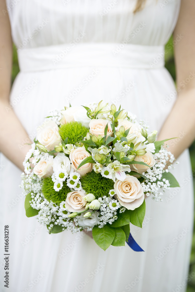 bride with wedding bouquet in hands