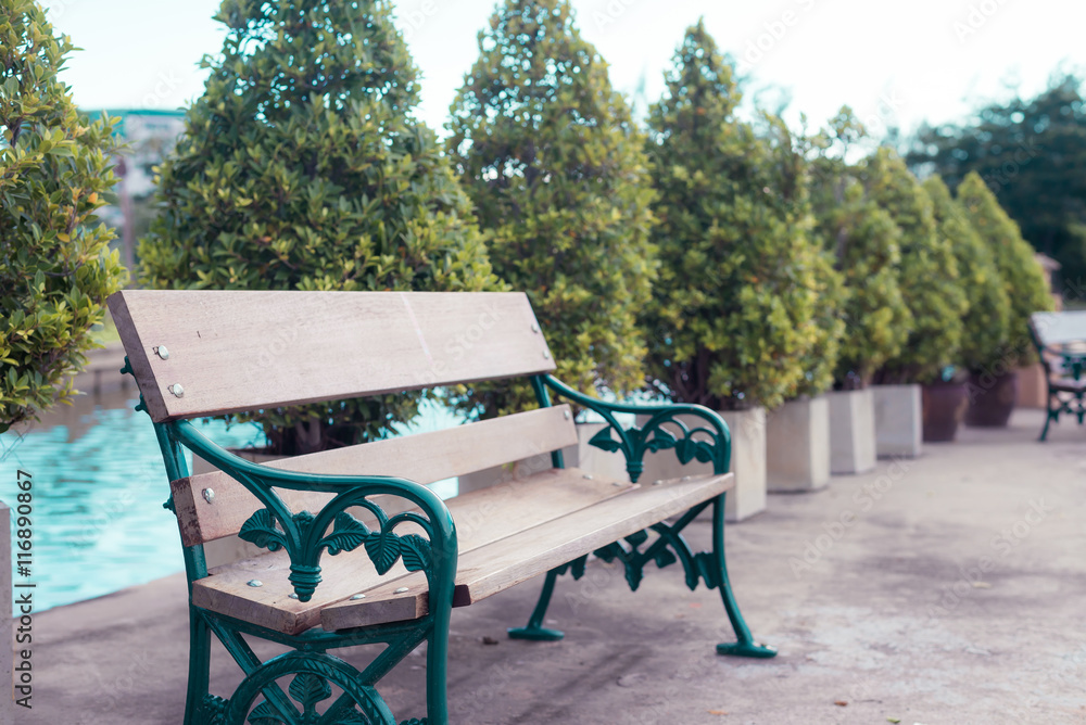 The wooden bench in the park.