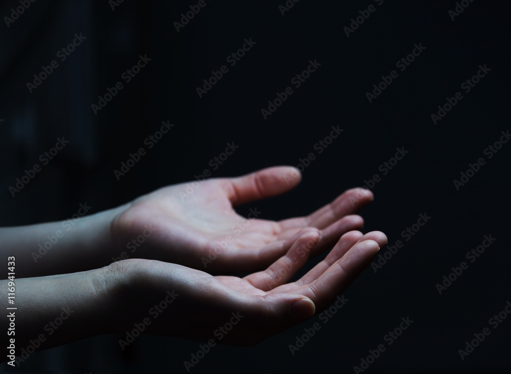 Businesswoman hand on black dark background