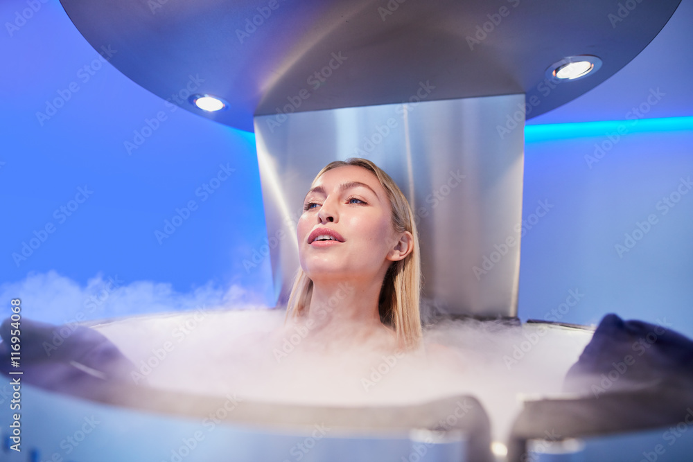 Young woman in a cryo sauna chamber