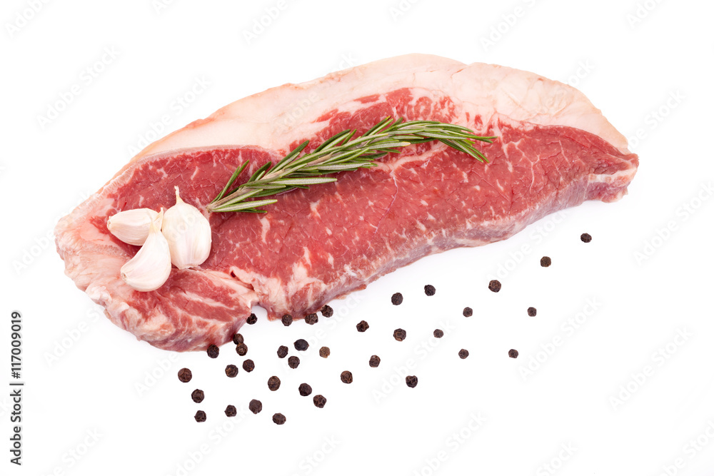 Raw red sirloin steak with rosemary, garlic , pepper