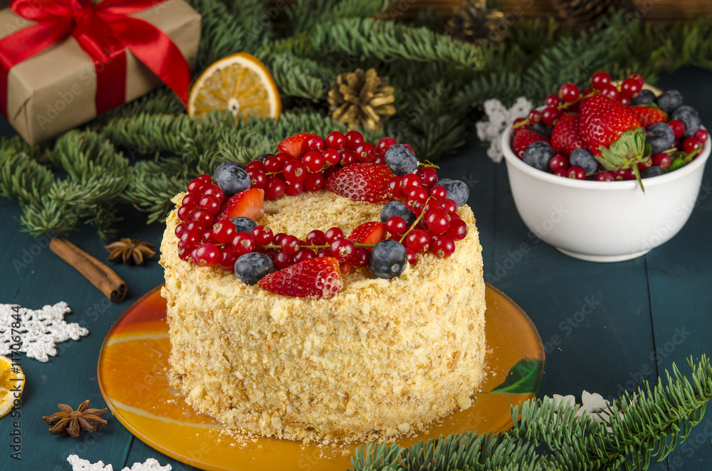 Napoleon cake with berries and fruit on wooden background. to celebrate Christmas or New Year decora