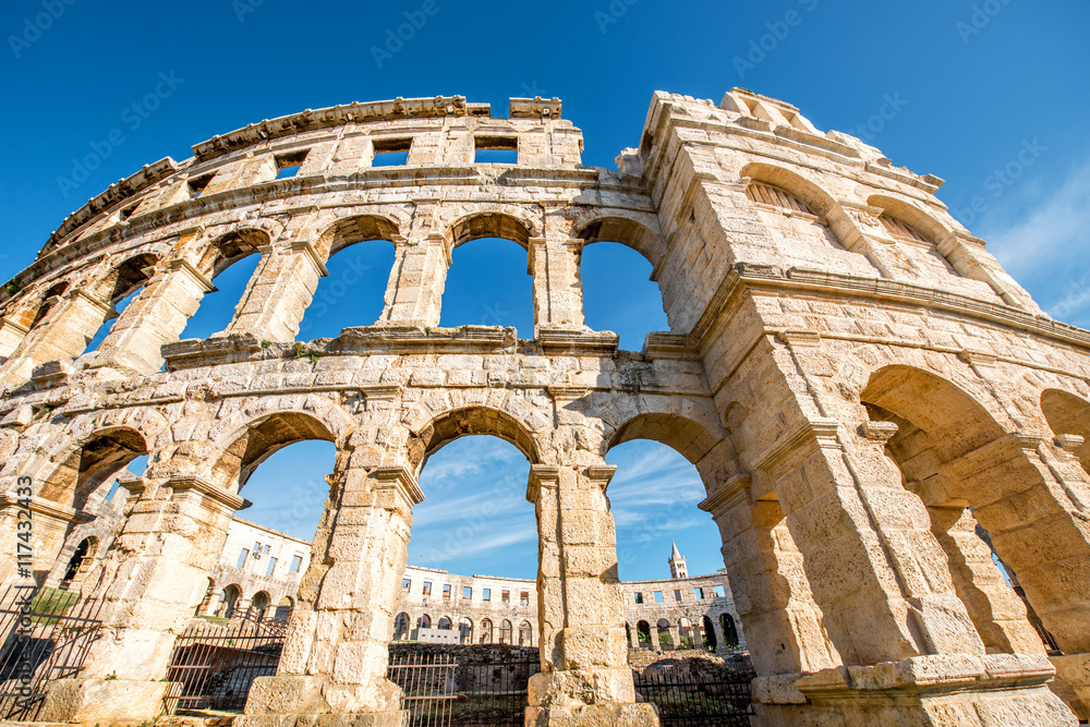 Architectural fragment of ancient roman amphitheatre in Pula city in Croatia.