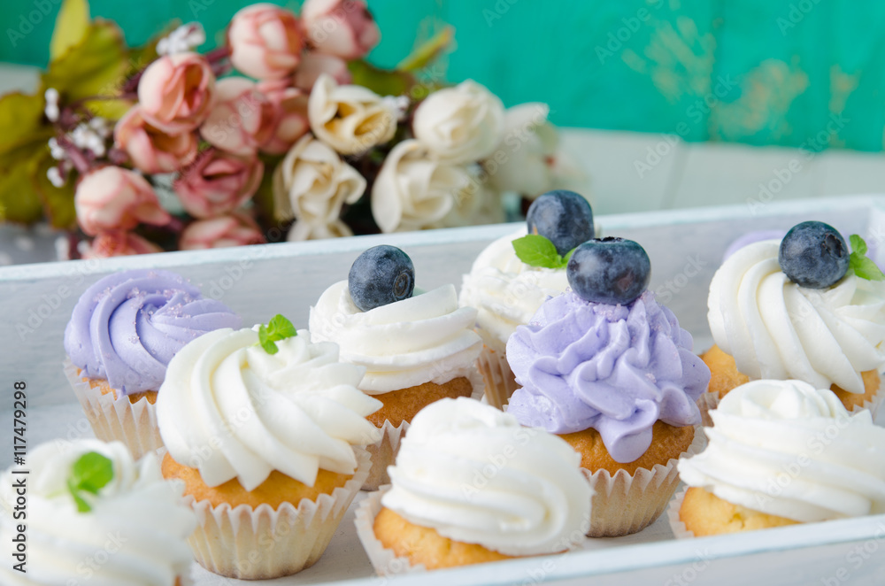 Summer cupcakes with blueberries and mint flavoured cream. Homemade.