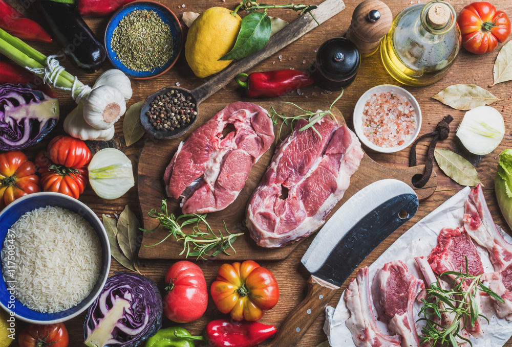 Ingredients for cooking meat dinner. Raw uncooked lamb meat assortment, rice, olive oil, spices and 