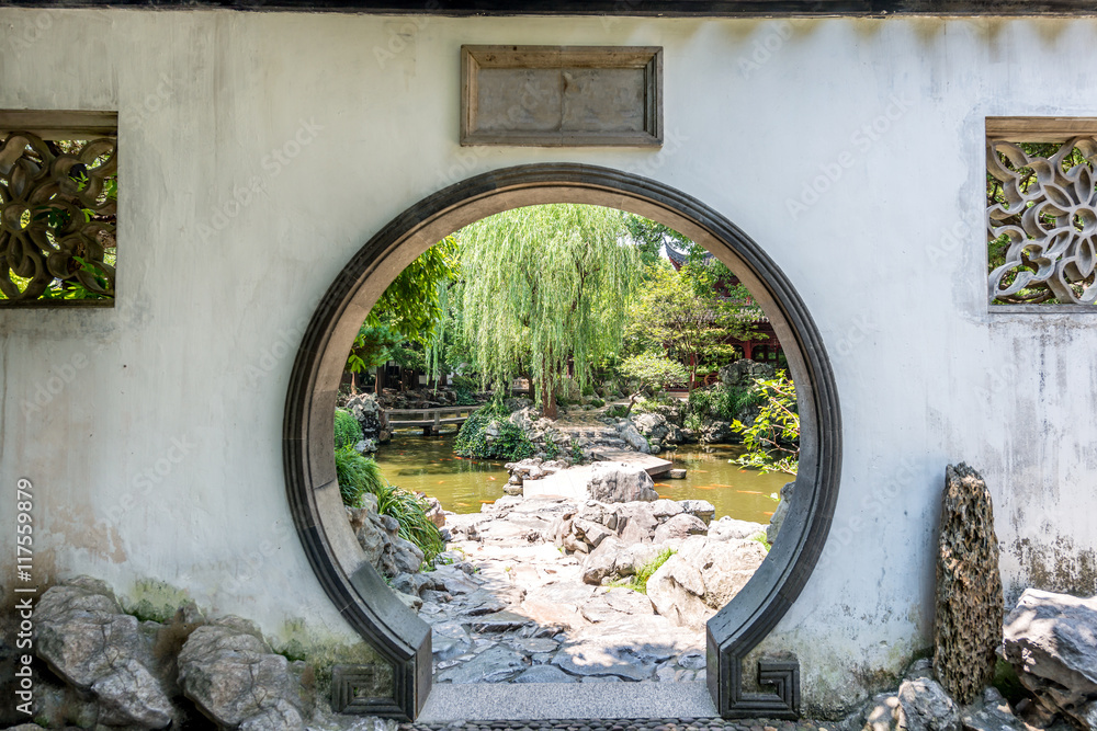 Traditional Chinese garden white round entrance. Yuyuan Chinese