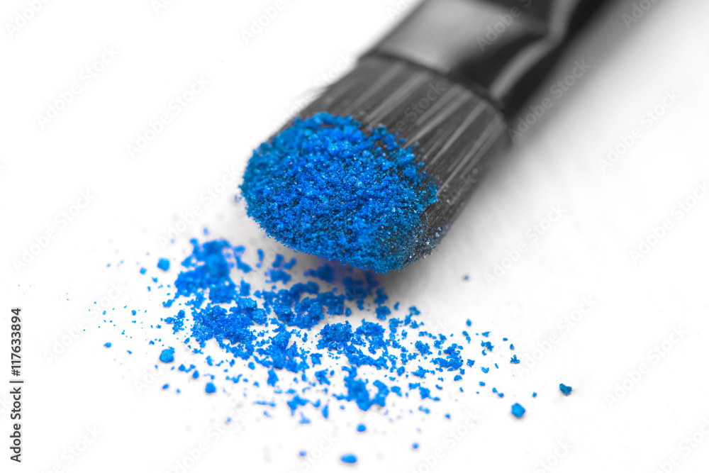 make-up brush on blue crushed eyeshadow