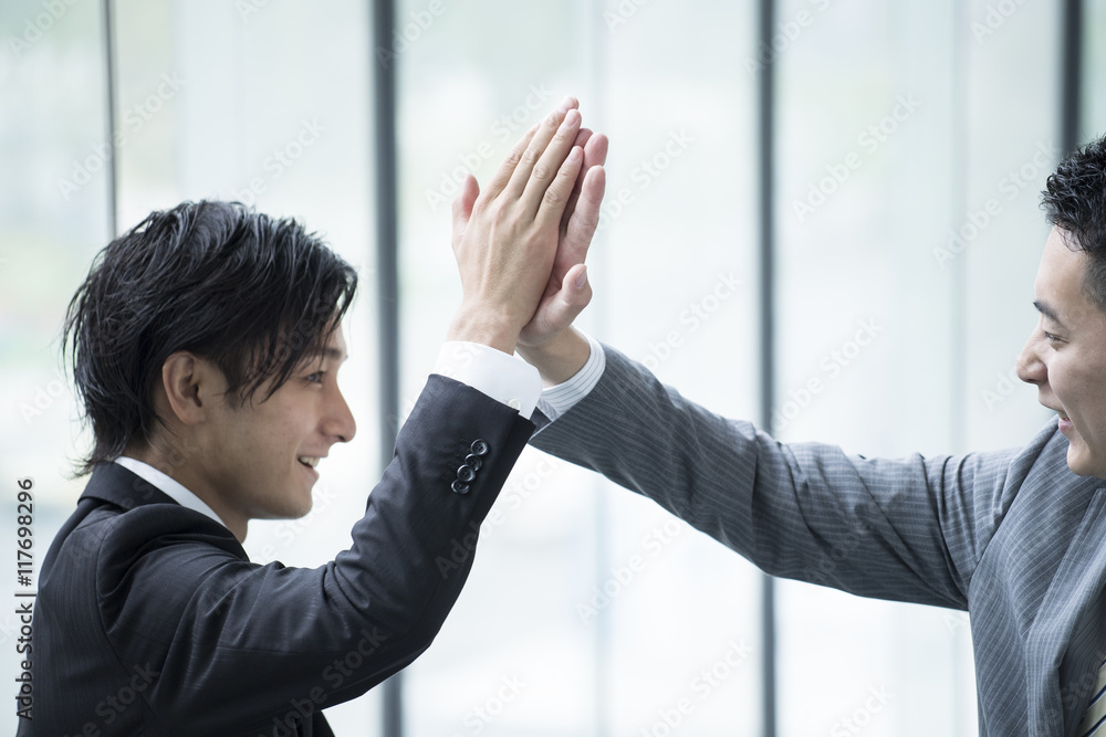 Businessmen have a high five