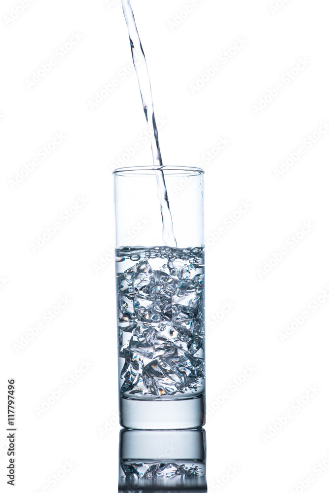 Drinking water is poured into a glass