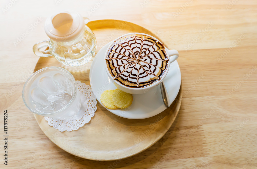 top view cup hot coffee and Syrup in bottle glass on table