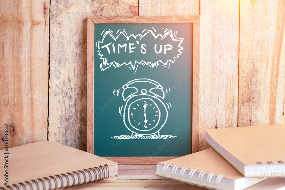 drawing of alarm clock on chalkboard